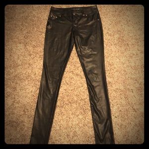 Tight fitting black polyester pants